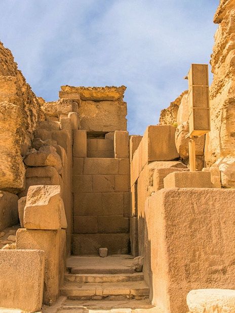 Entrance to the Giza Pyramids complex, showcasing ancient stone architecture.