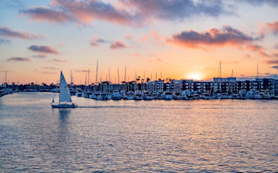 Sailboat on Marina del Rey waters at sunset during Premier Dinner Cruise.
