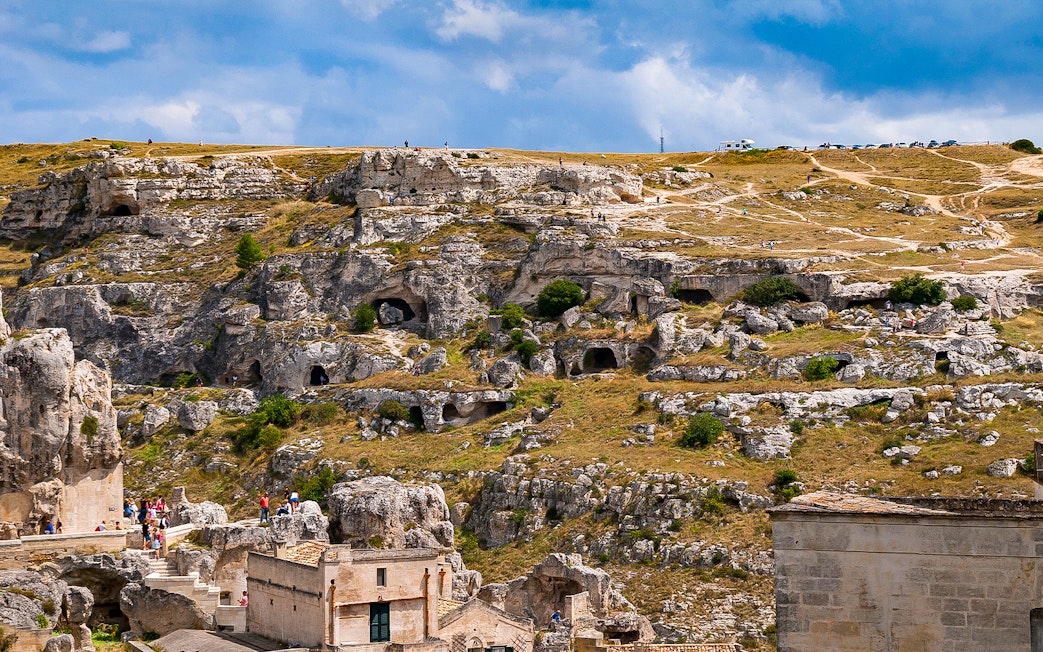 Rugged landscape of Murgia Park with ancient rupestrian churches and caves, Matera, Italy.