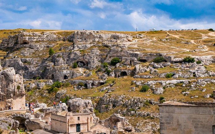 Rugged landscape of Murgia Park with ancient rupestrian churches and caves, Matera, Italy.