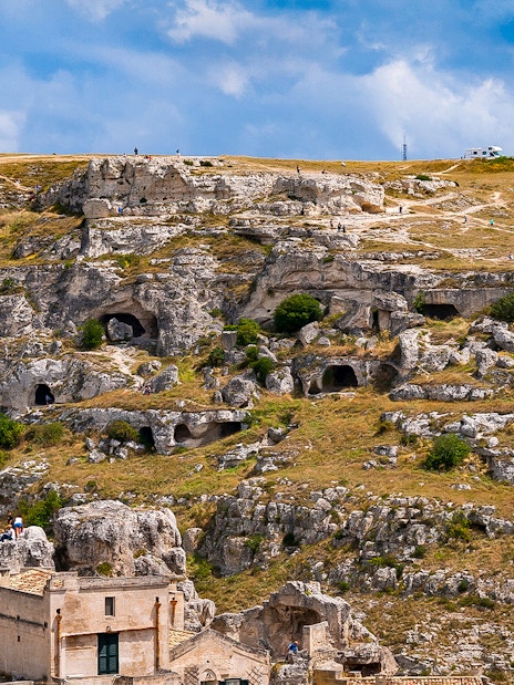 Rugged landscape of Murgia Park with ancient rupestrian churches and caves, Matera, Italy.