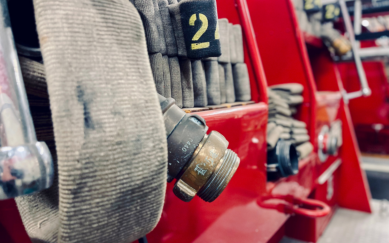 Close-up of hose and fittings on an Old Mack fire engine.