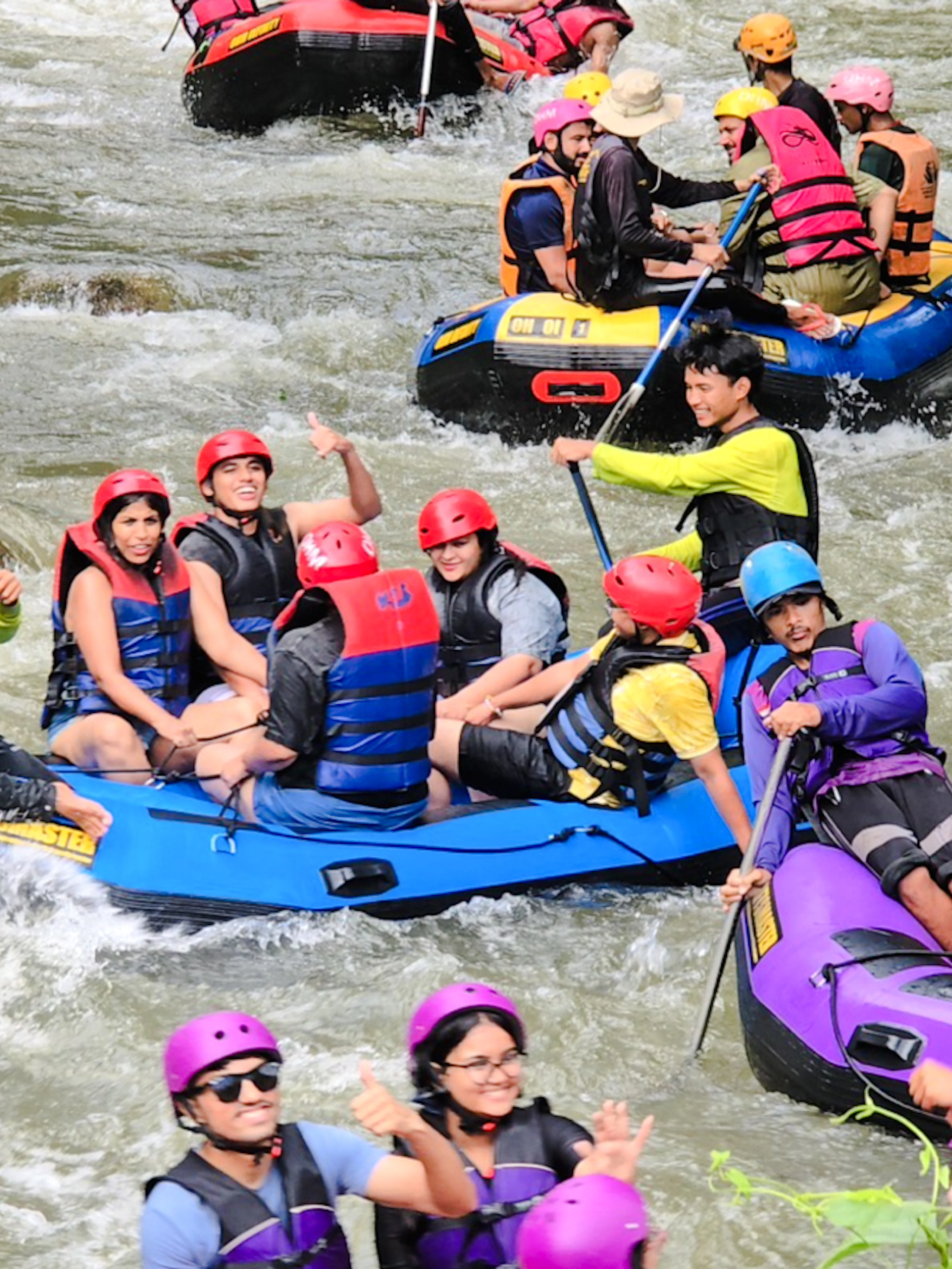 Group enjoying white water rafting on Phang Nga River, Phuket.