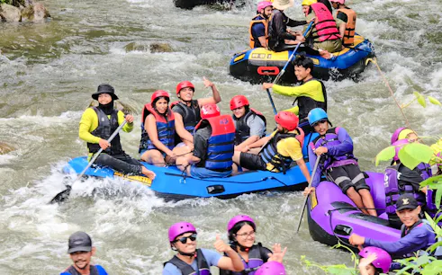 Group enjoying white water rafting on Phang Nga River, Phuket.