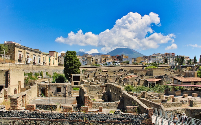 Aerial view of Herculaneum ruins with Mount Vesuvius in the background, Italy.