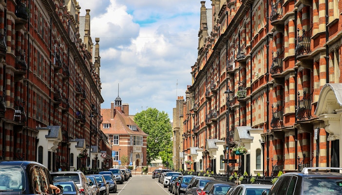Red brick buildings lining Glentworth Street, Marylebone, London, with parked cars.