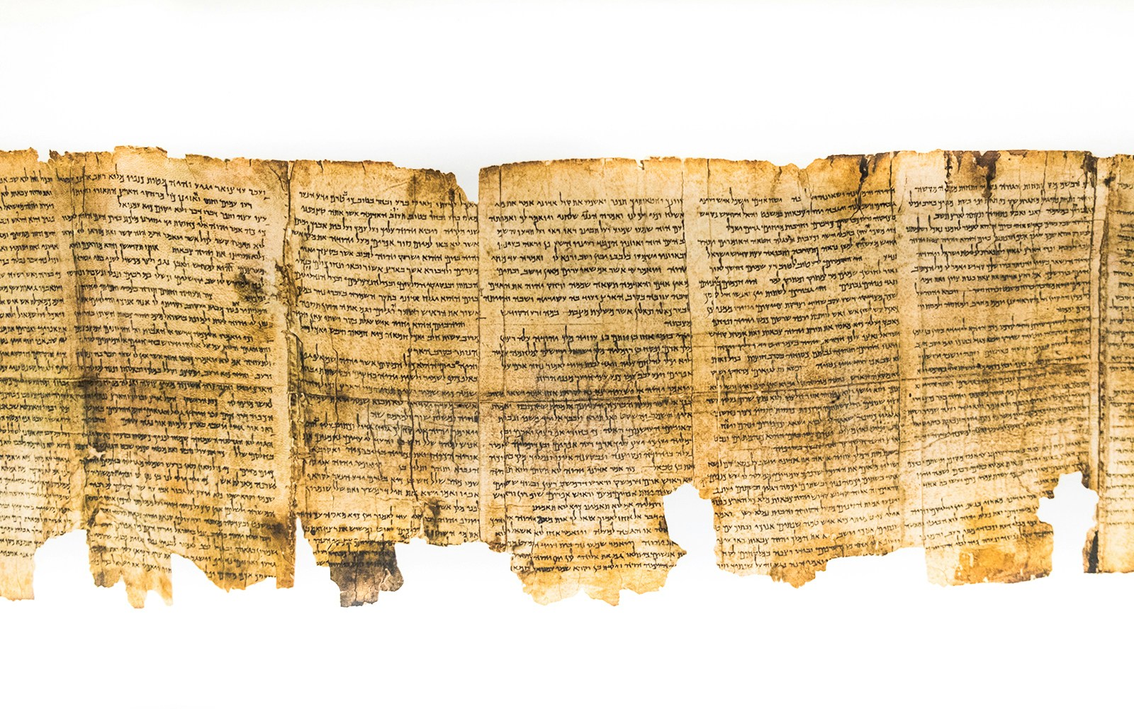 Ancient Dead Sea Scroll fragment with Hebrew text.