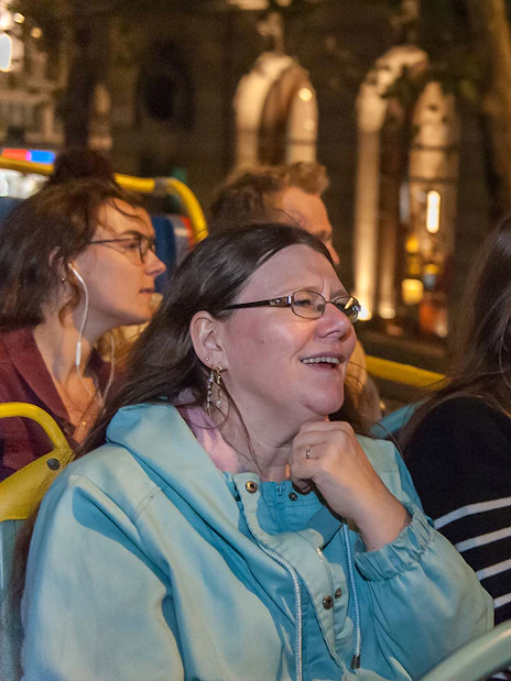 Passengers enjoying Tootbus London evening tour on an open-top bus.