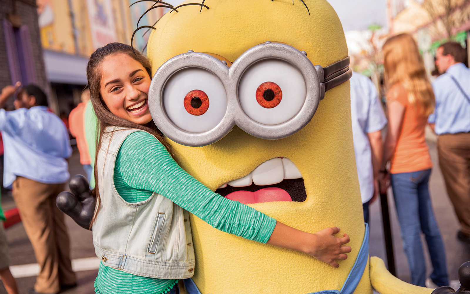 Visitor hugging a Minion character at Universal Studios Hollywood.