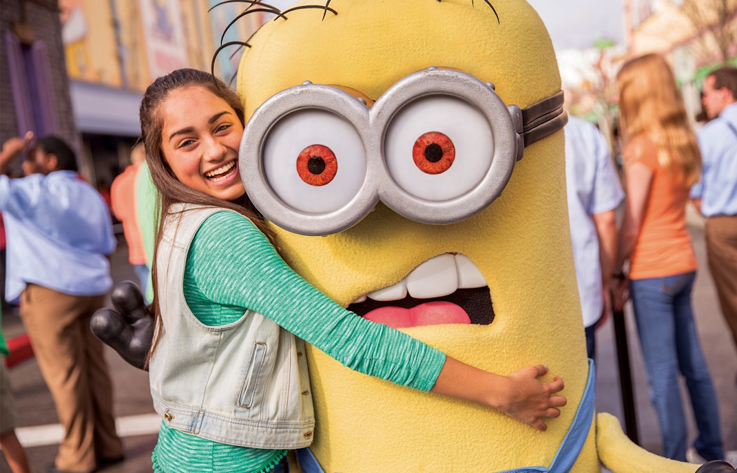 Visitor hugging a Minion character at Universal Studios Hollywood.