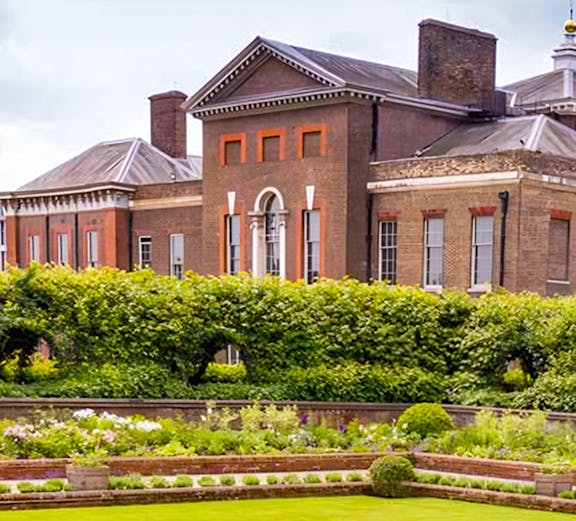 Kensington Palace with lush gardens in London, England.