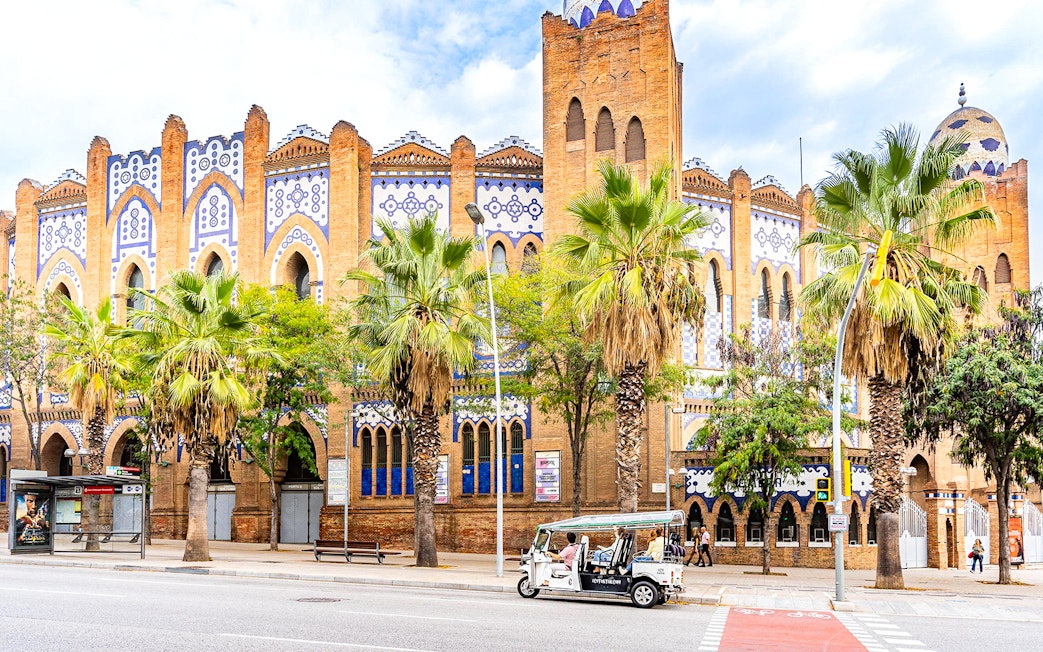 Tuk tuk in front of the historic Plaza de Toros Monumental in Barcelona.
