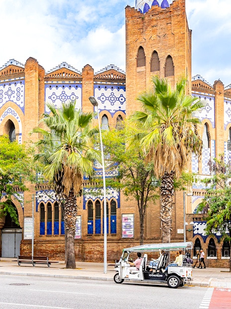 Tuk tuk in front of the historic Plaza de Toros Monumental in Barcelona.
