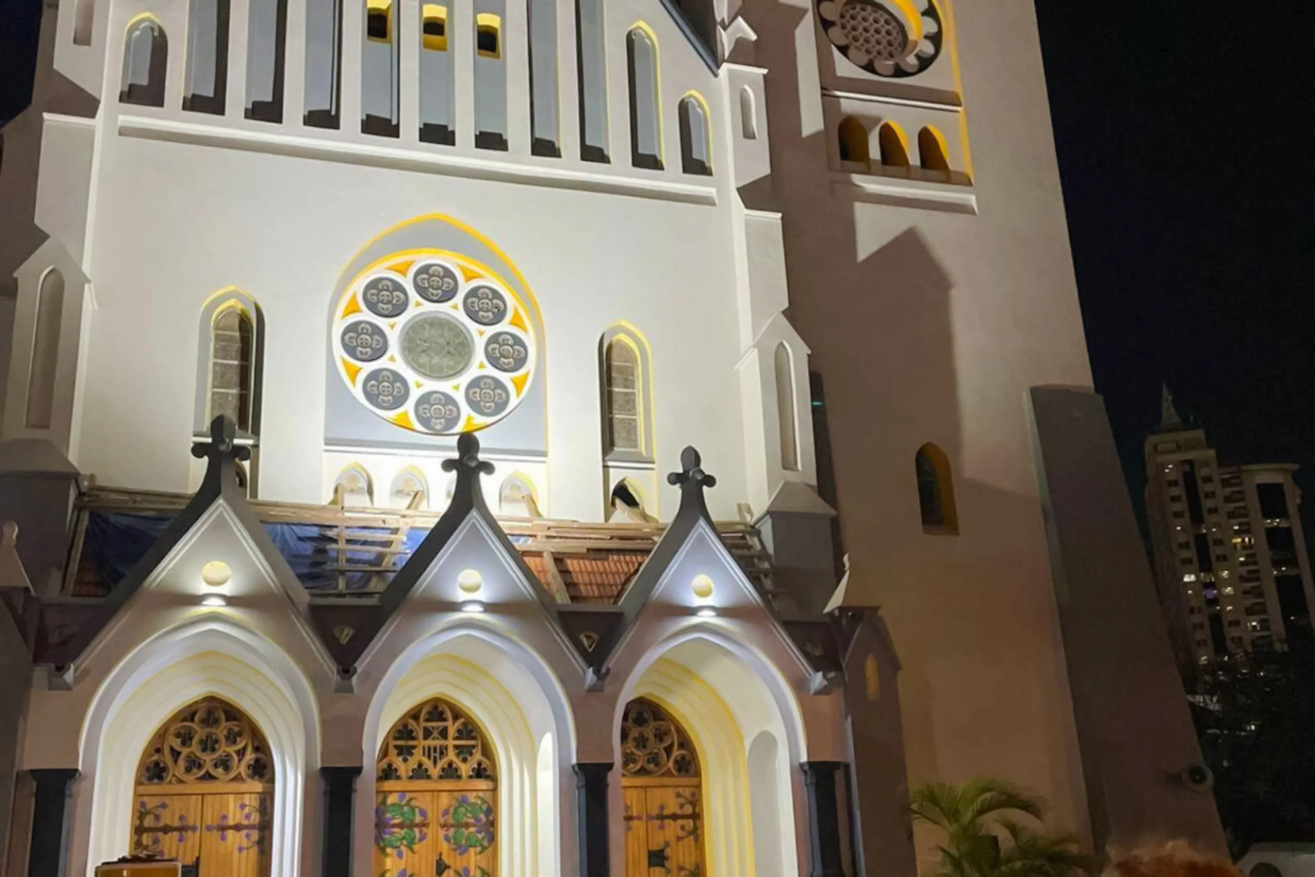 St. Joseph's Cathedral facade illuminated at night, Dar es Salaam city tour.