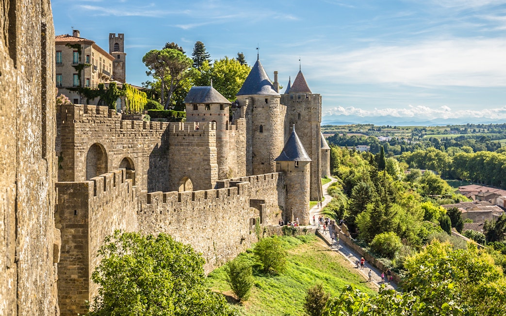 Carcassonne castle ramparts with towers and surrounding landscape.
