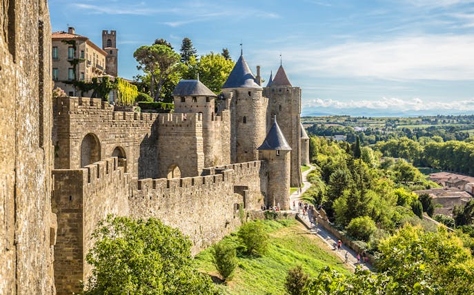 Carcassonne castle ramparts with towers and surrounding landscape.
