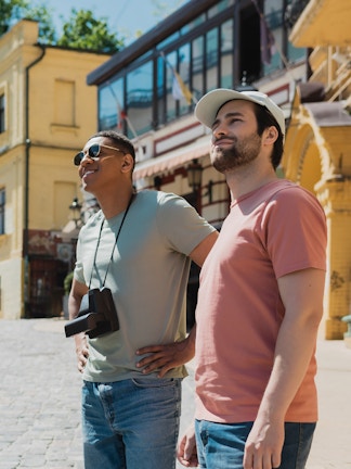 Tourists exploring a historic street near Blue Planet Aquarium.
