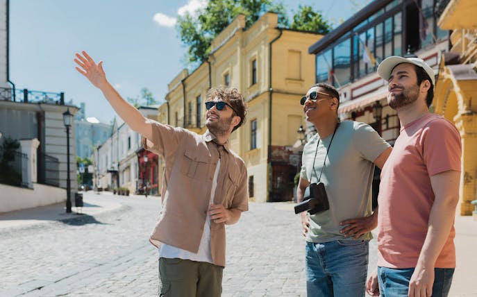 Tourists exploring a historic street near Blue Planet Aquarium.
