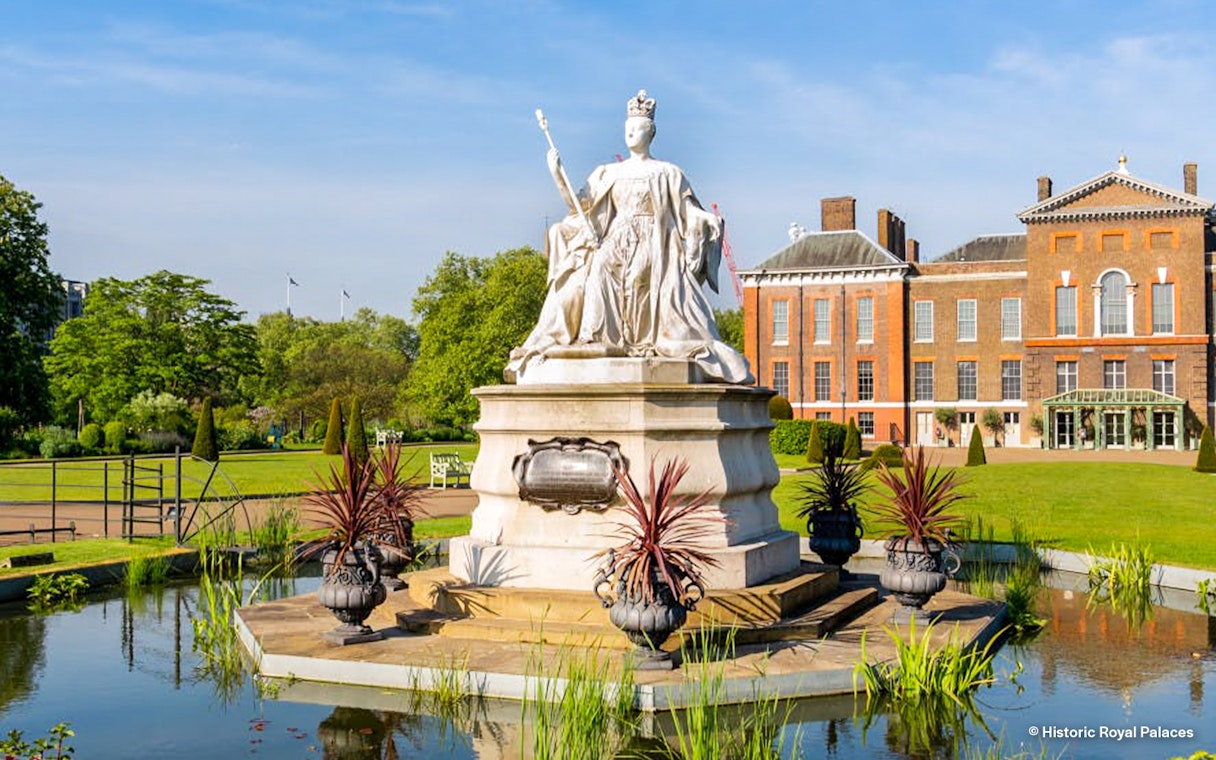 Kensington Palace gardens with statue, London Eye tour tickets available.