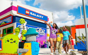 Family exploring LEGO Galaxy area at LEGOLAND California Resort's Galacticoaster.
