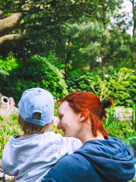 Family enjoying the talking tree attraction at Efteling, Netherlands.