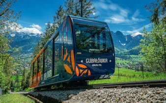Funicular ascending Gubałówka Hill with Tatra Mountains view, Zakopane day trip from Krakow.