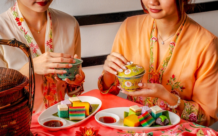 Traditional desserts with tea served at Wings of Time Fireworks Symphony show.