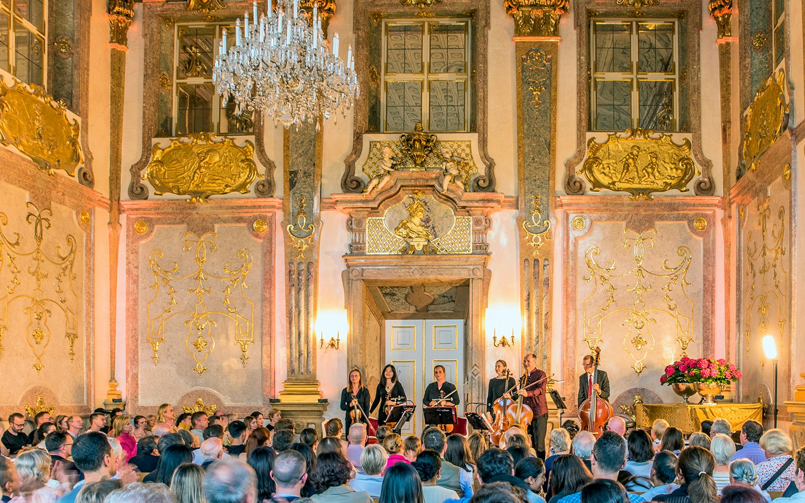 Musicians performing classical music at Mirabell Palace concert hall, Salzburg.