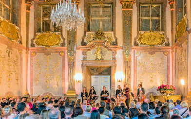 Musicians performing classical music at Mirabell Palace concert hall, Salzburg.