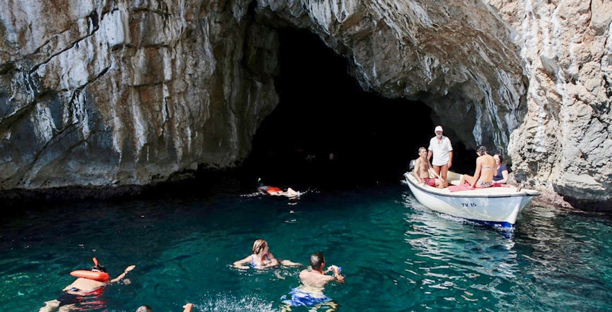Swimmers exploring the Blue Cave, Kotor, Montenegro.