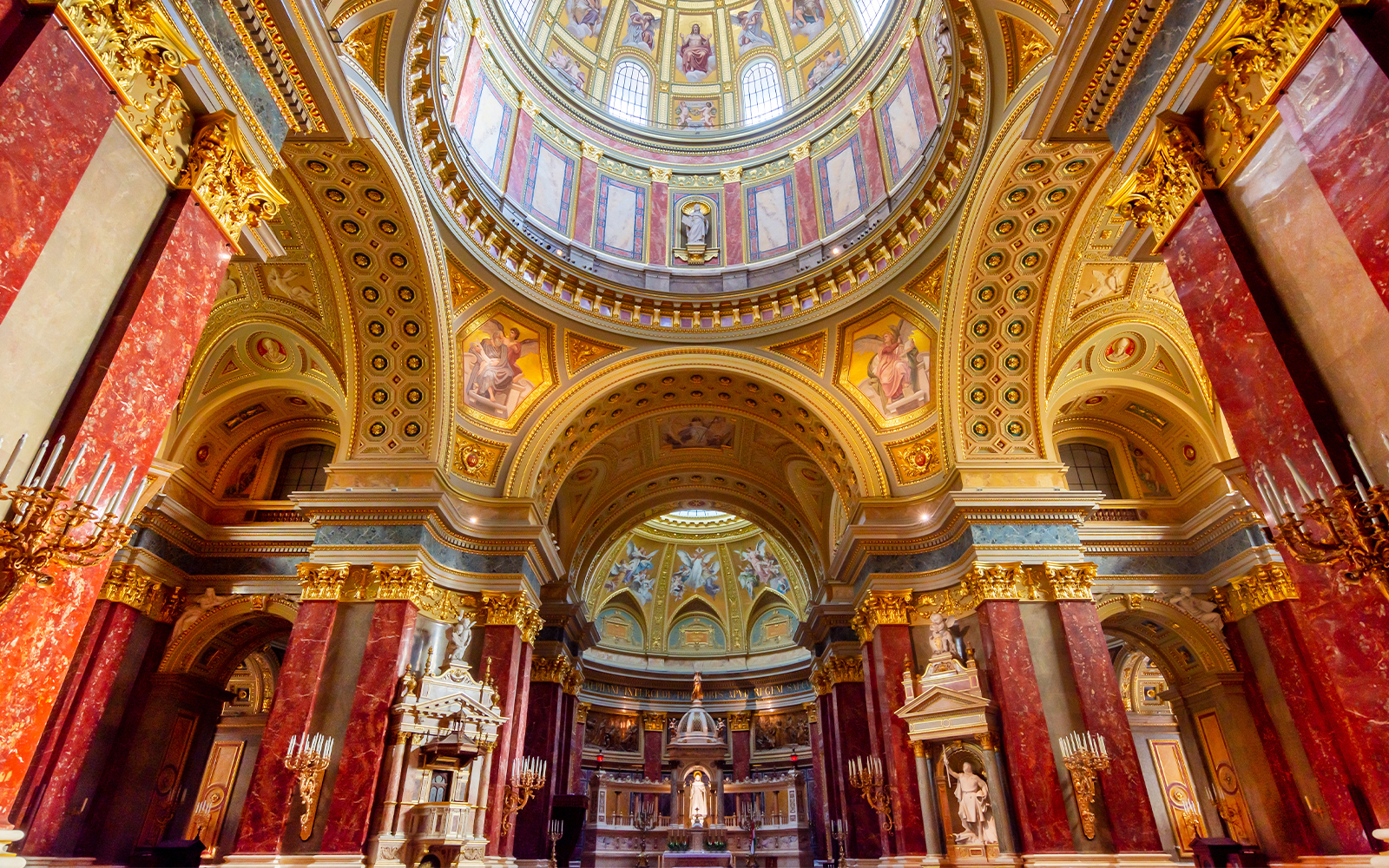St. Stephen's Basilica interior with ornate dome and columns in Budapest, Hungary.