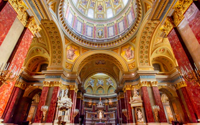 St. Stephen's Basilica interior with ornate dome and columns in Budapest, Hungary.