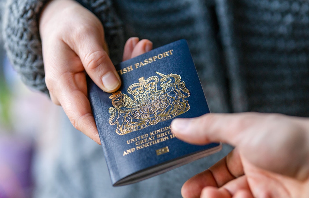 Tourist holding passport