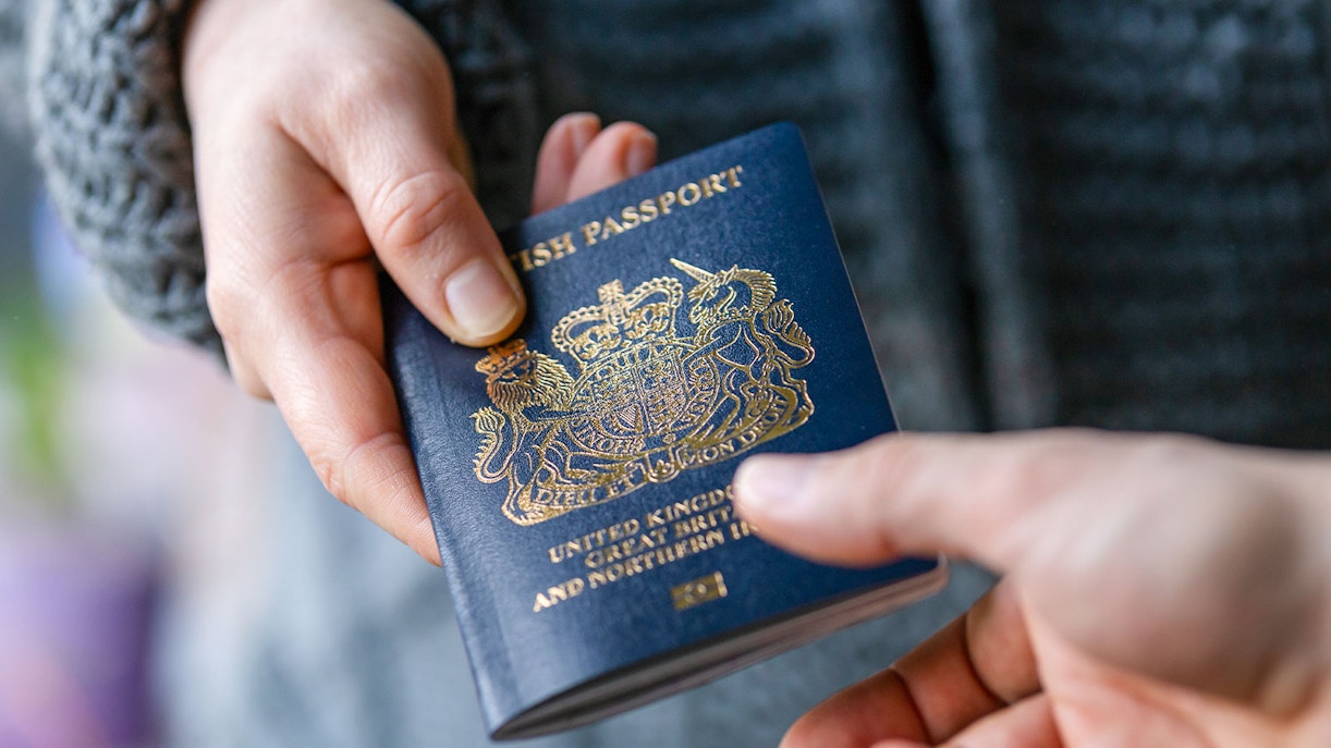 Person  handing passport