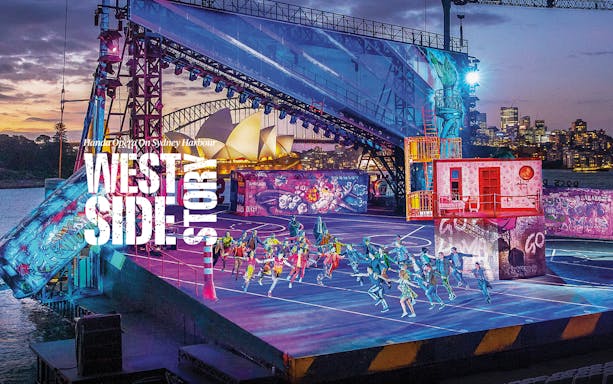 West Side Story performance on Sydney Harbour stage with Opera House in background.