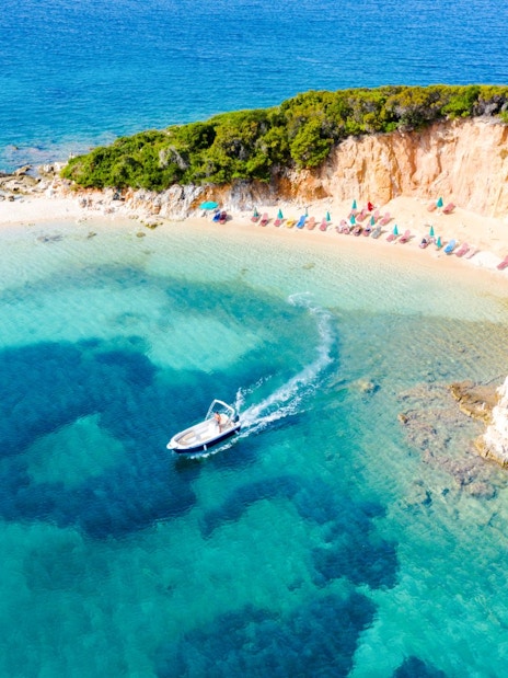 Aerial view of a boat near the Tetran Archipelago beach, Ksamil, Albania.