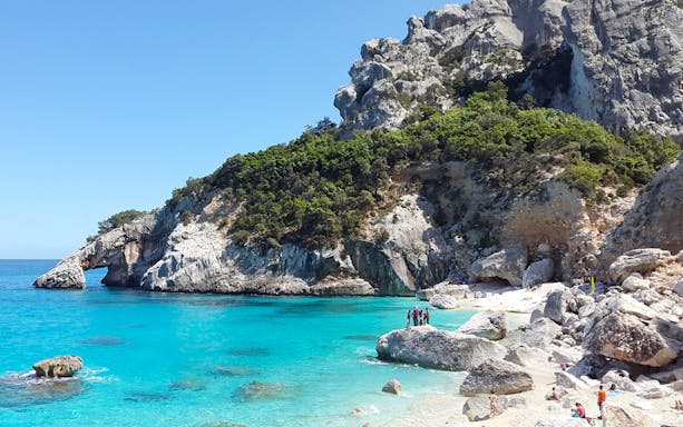 Tourists on a beach in the Gulf of Orosei