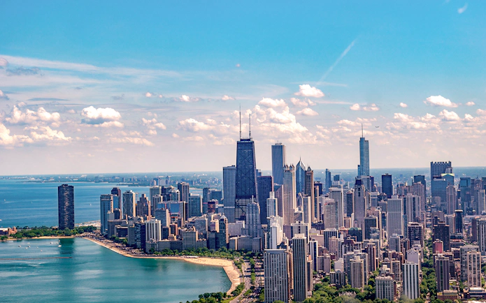 Chicago skyline with Lake Michigan and prominent skyscrapers.