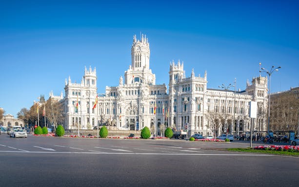 Hop-on hop-off bus tour in Madrid passing the Royal Palace with optional Prado Gallery tickets.