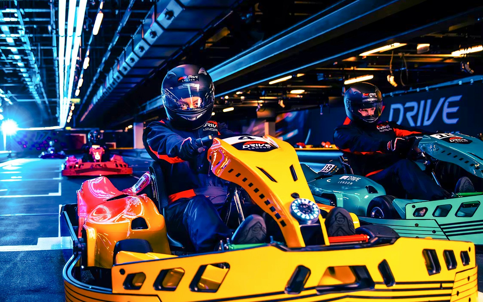 Guests driving go-karts at Elite F1 Drive experience in London.