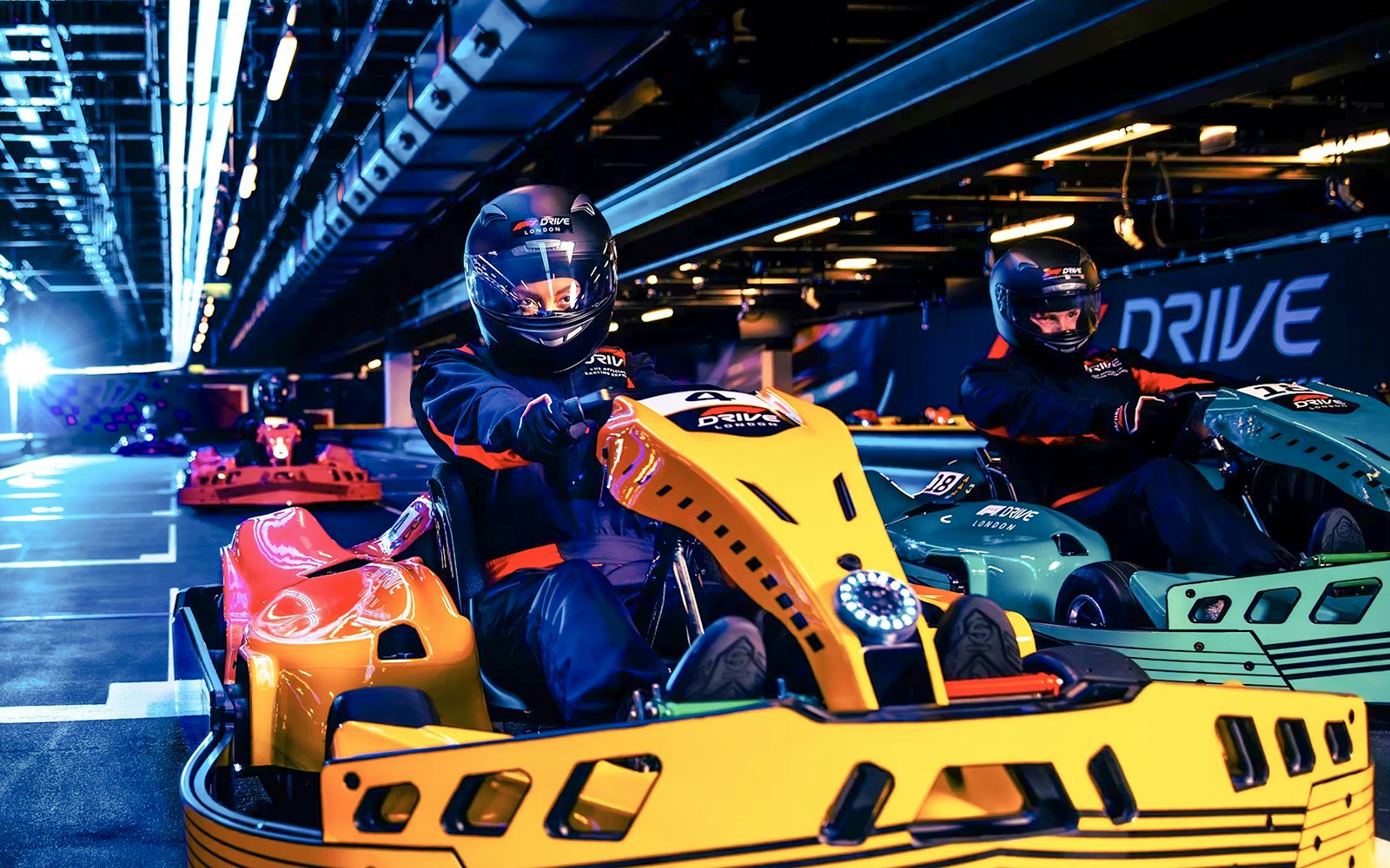 Guests driving go-karts at Elite F1 Drive experience in London.
