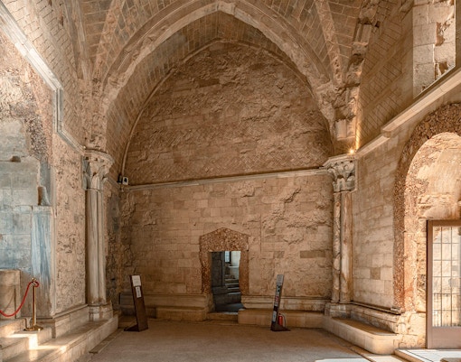 Castel del Monte interior with octagonal columns and vaulted ceilings in Andria, Italy.