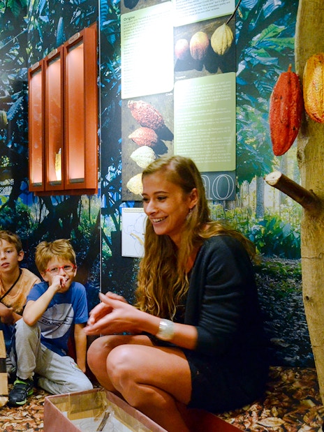 Children learning about cocoa at Choco-Story Paris museum.
