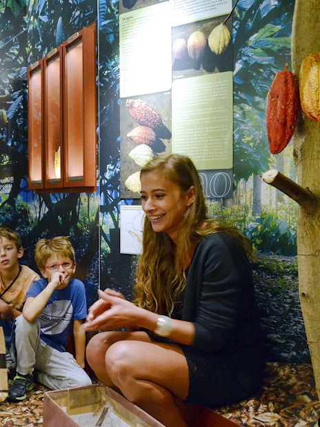 Children learning about cocoa at Choco-Story Paris museum.