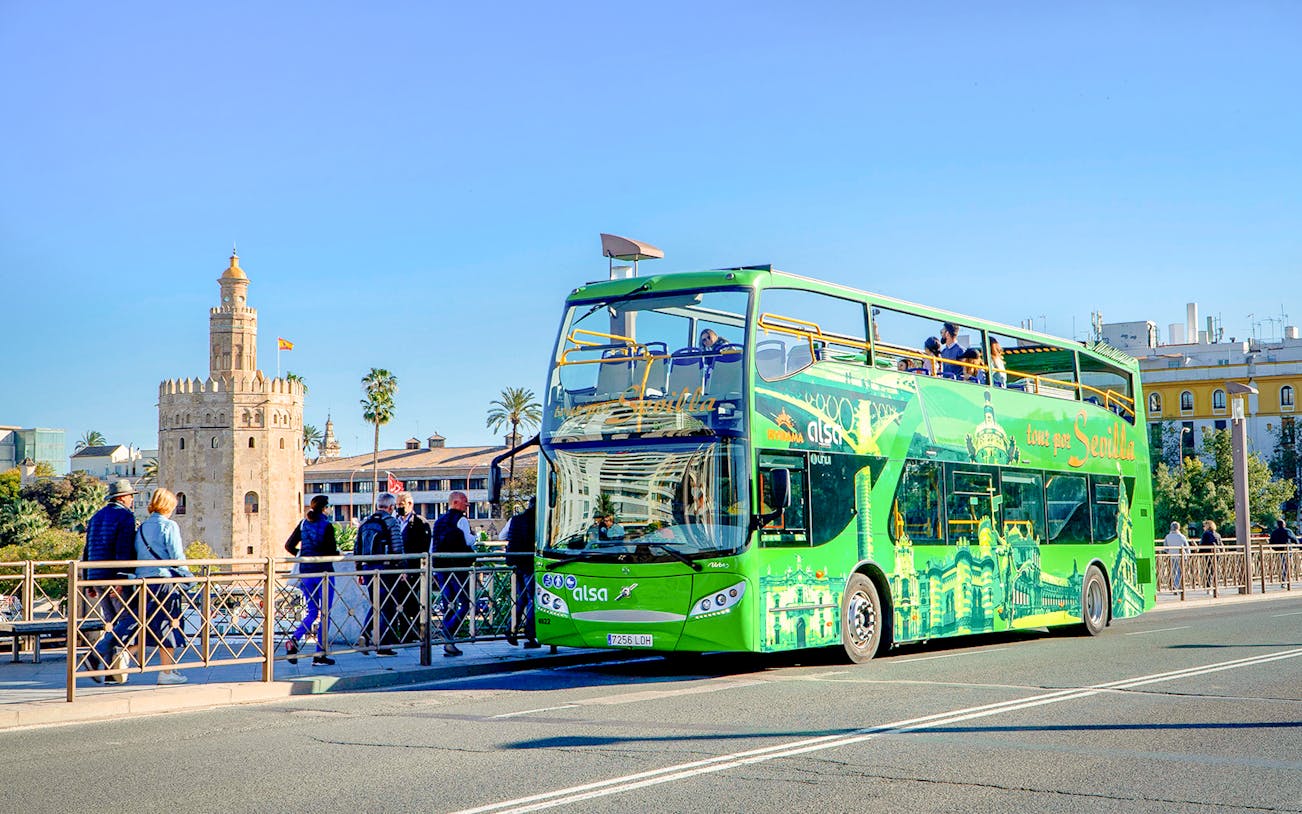 Hop-on hop-off bus near Torre del Oro, Seville.