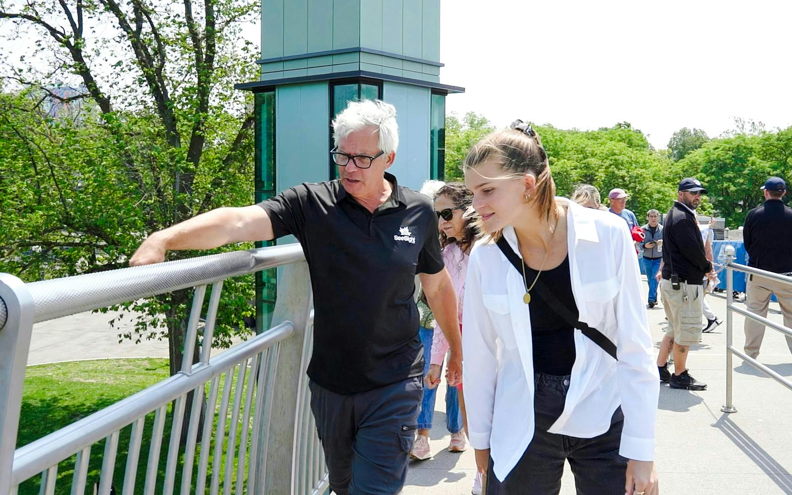Visitors exploring a viewing platform at Niagara Falls, USA.