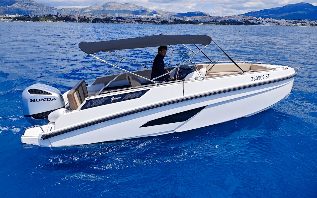 Speedboat cruising near Trogir during Blue Lagoon half-day tour.
