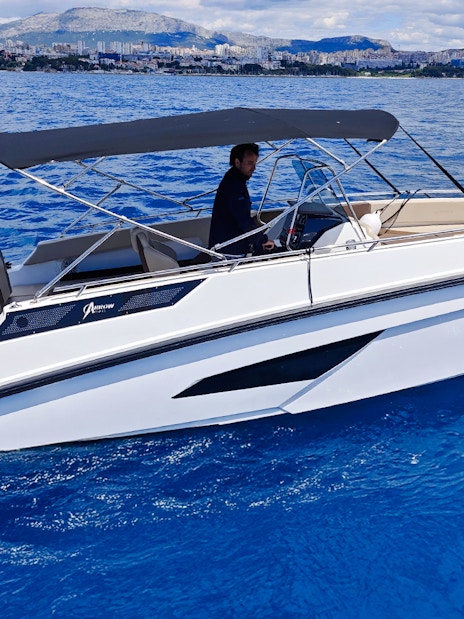 Speedboat cruising near Trogir during Blue Lagoon half-day tour.