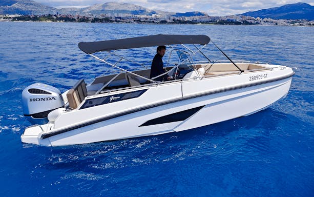 Speedboat cruising near Trogir during Blue Lagoon half-day tour.