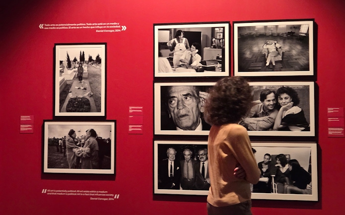 Tourist viewing black-and-white photo exhibit at the Russian Museum.